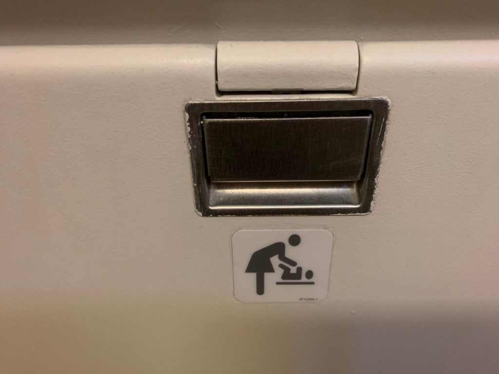 diaper changing station in an airplane toilet